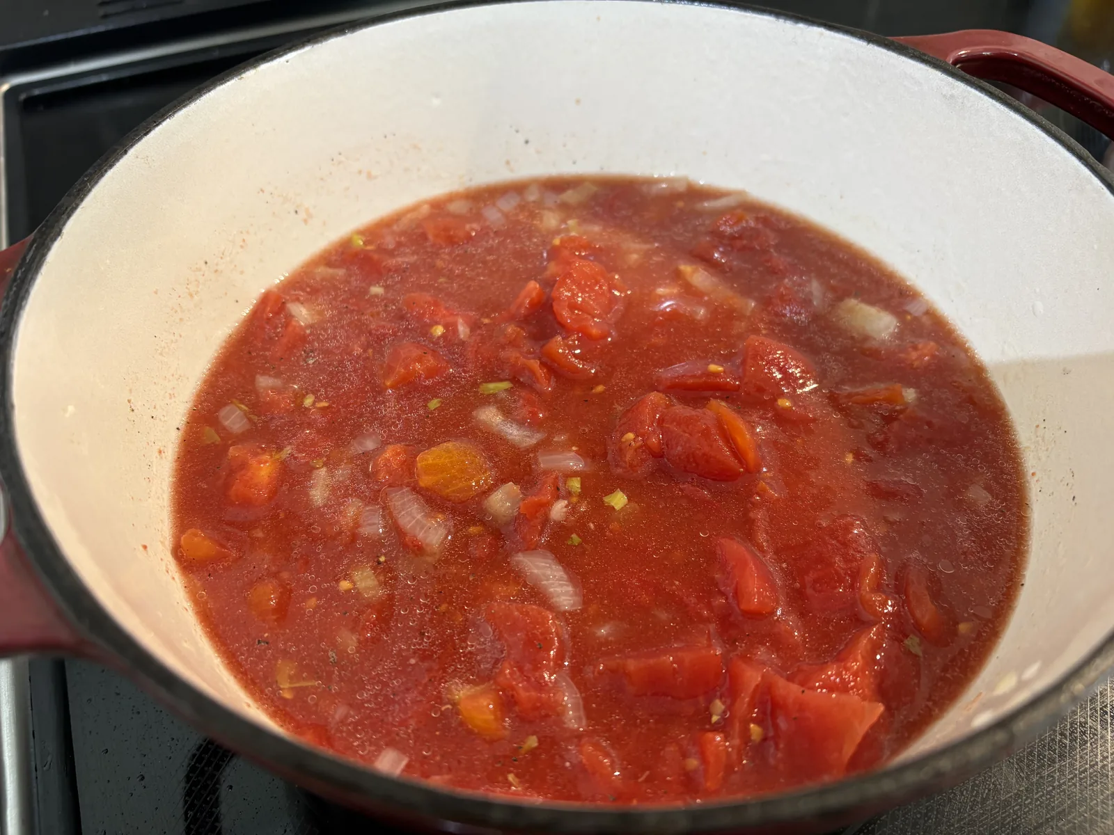 Add canned tomatoes, paste and seasonings