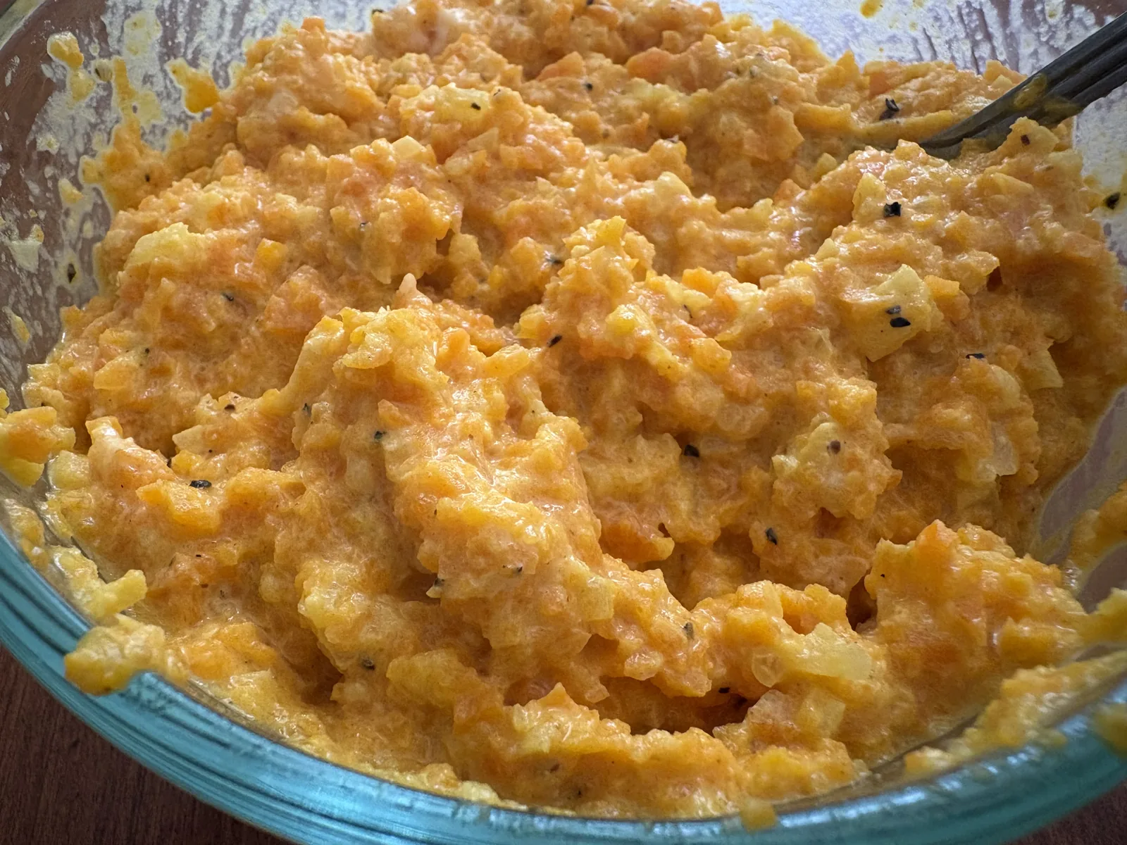 close up of carrot spread in bowl
