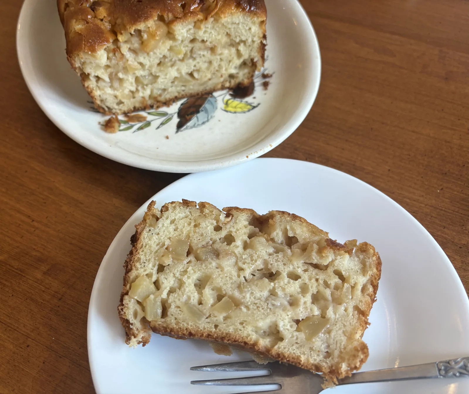 closeup apple slice on plate and loaf in background