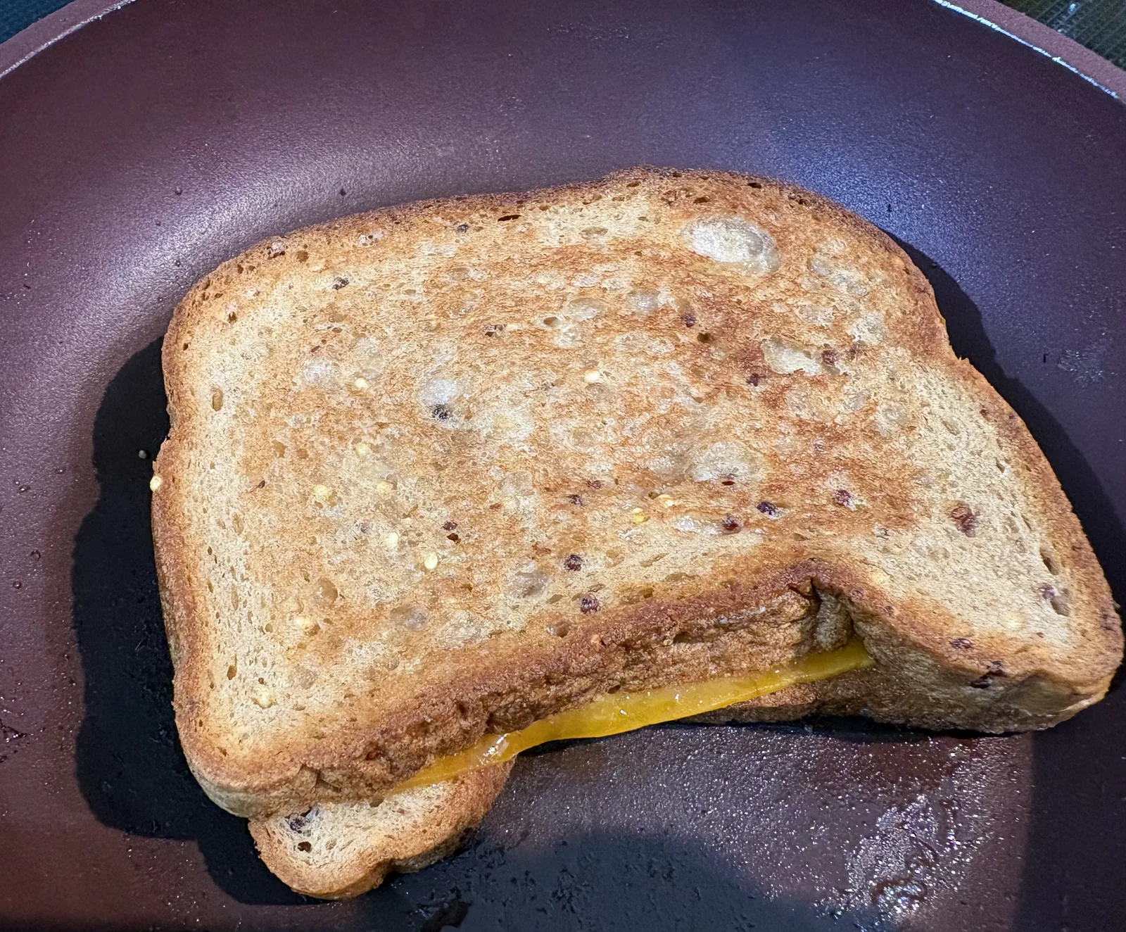 Finished grilled cheese in frying pan