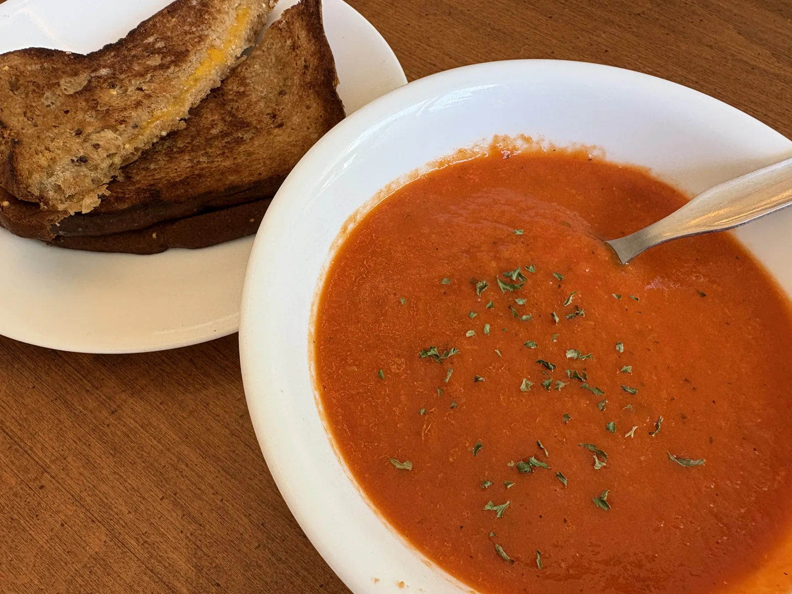 gluten free tomato soup in bowl with grilled cheese