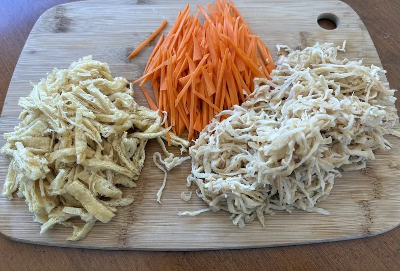 kiriboshi daikon carrot and aburrage on cutting board