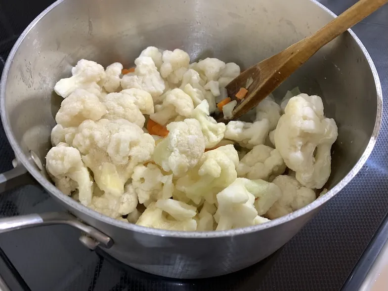Add cauliflower florets to the pot