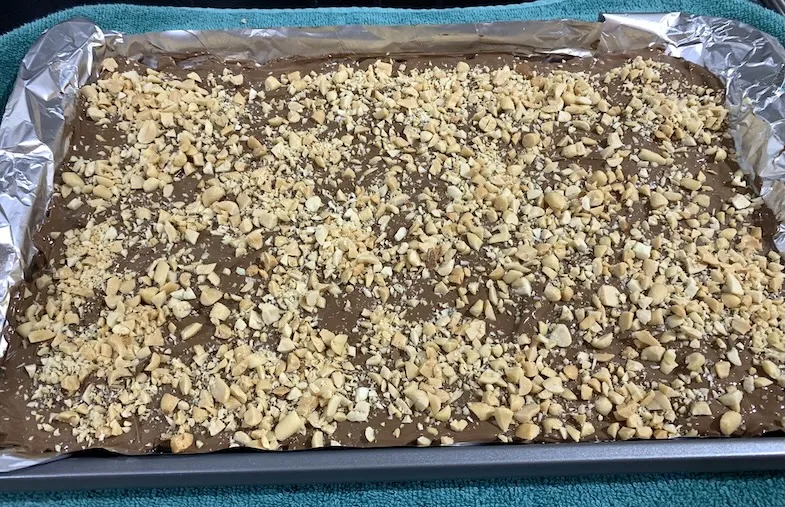 sprinkle the crushed peanuts on the gluten-free Christmas Crack