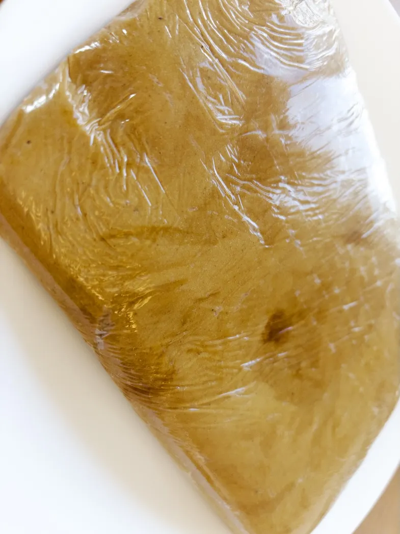gluten-free gingerbread cookie dough wrapped for chilling