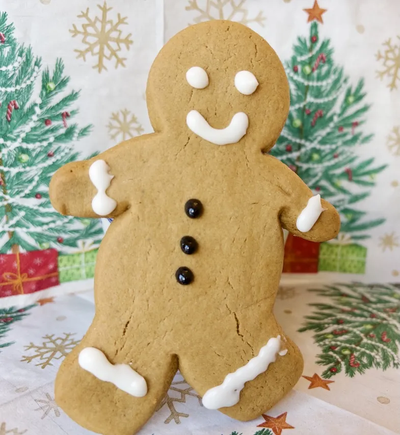 gluten-free gingerbread man standing by tree