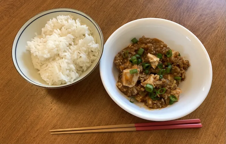 gluten-free mabo dofu with a bowl of rice