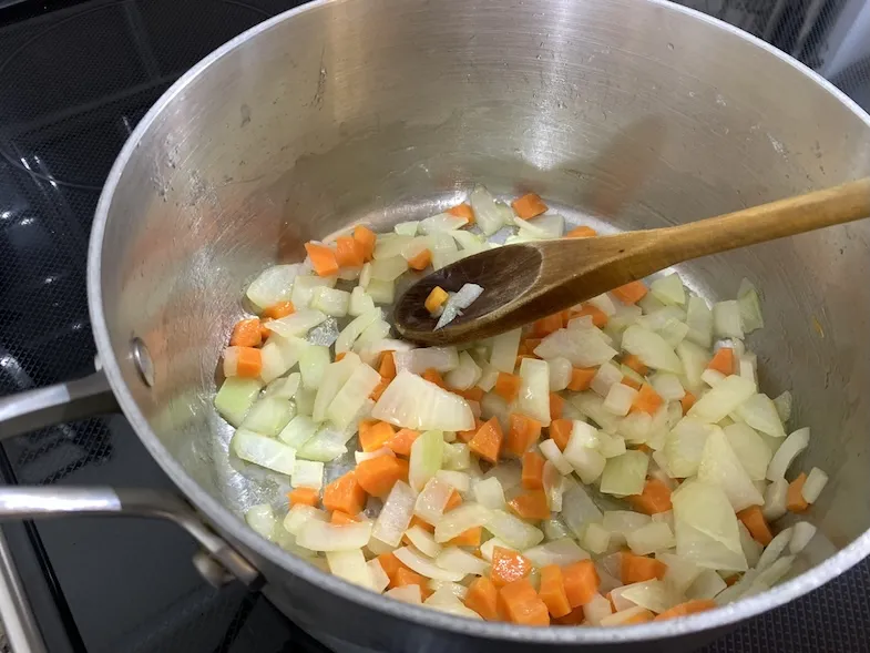 Add onions and carrots to the pot