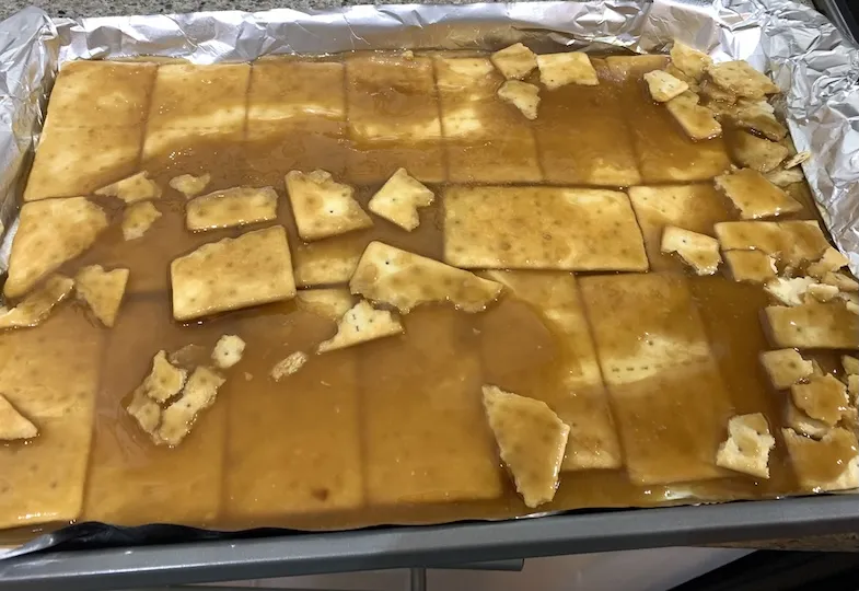 pour caramel sauce on the crackers