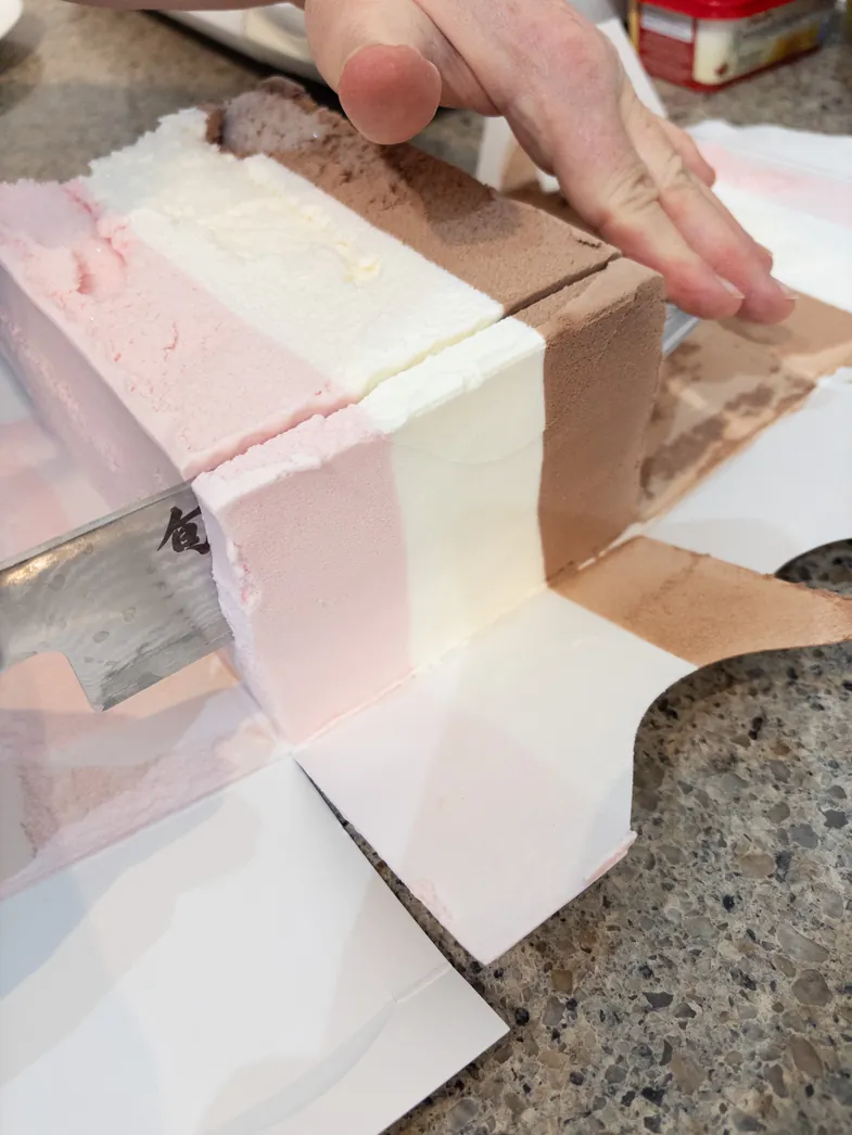 slicing the ice cream block