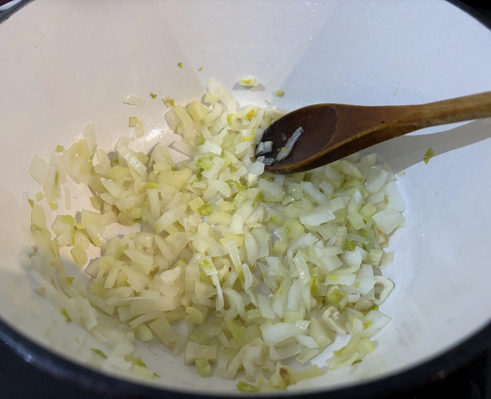 onions celery and garlic frying in oil