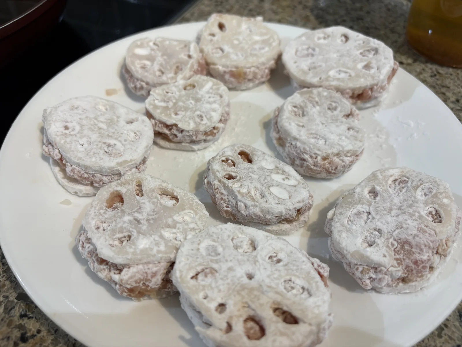 plate of stuffed renkon dusted in potato starch