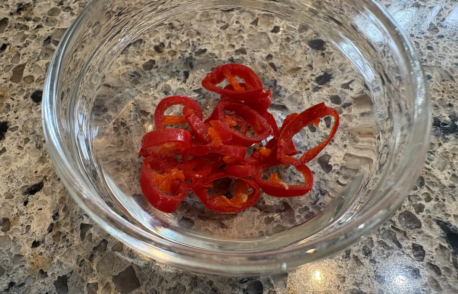 small red chilis cut up in bowl