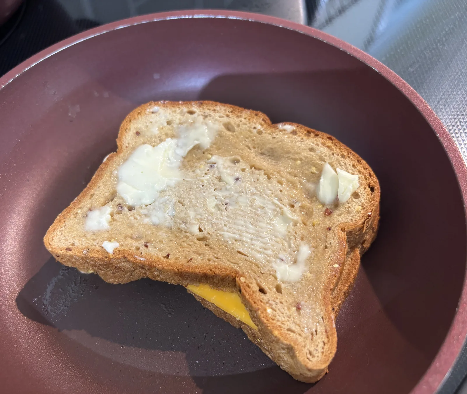 top slice of buttered gluten free bread